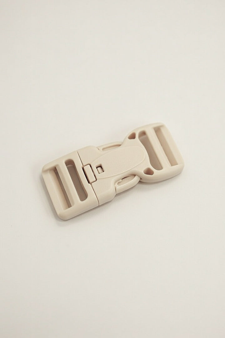 Schnalle mit Sicherheitsknopf 25mm beige